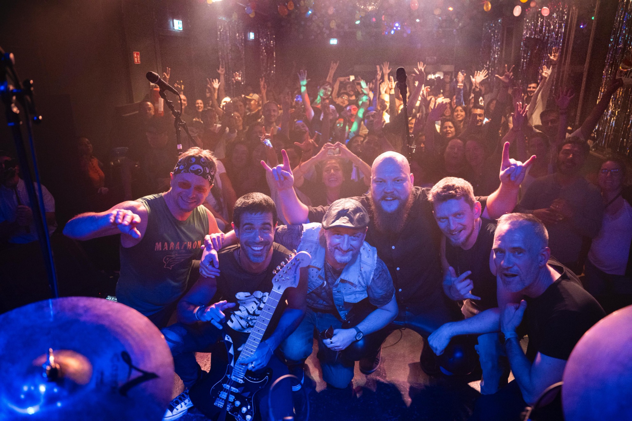 The band with the crowd after a live show in Vienna